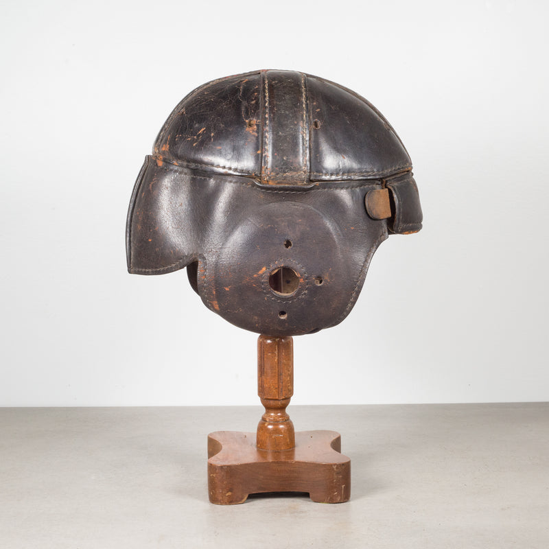 bronze football helmet Antique Leather Football Helmet and Stand c.1900