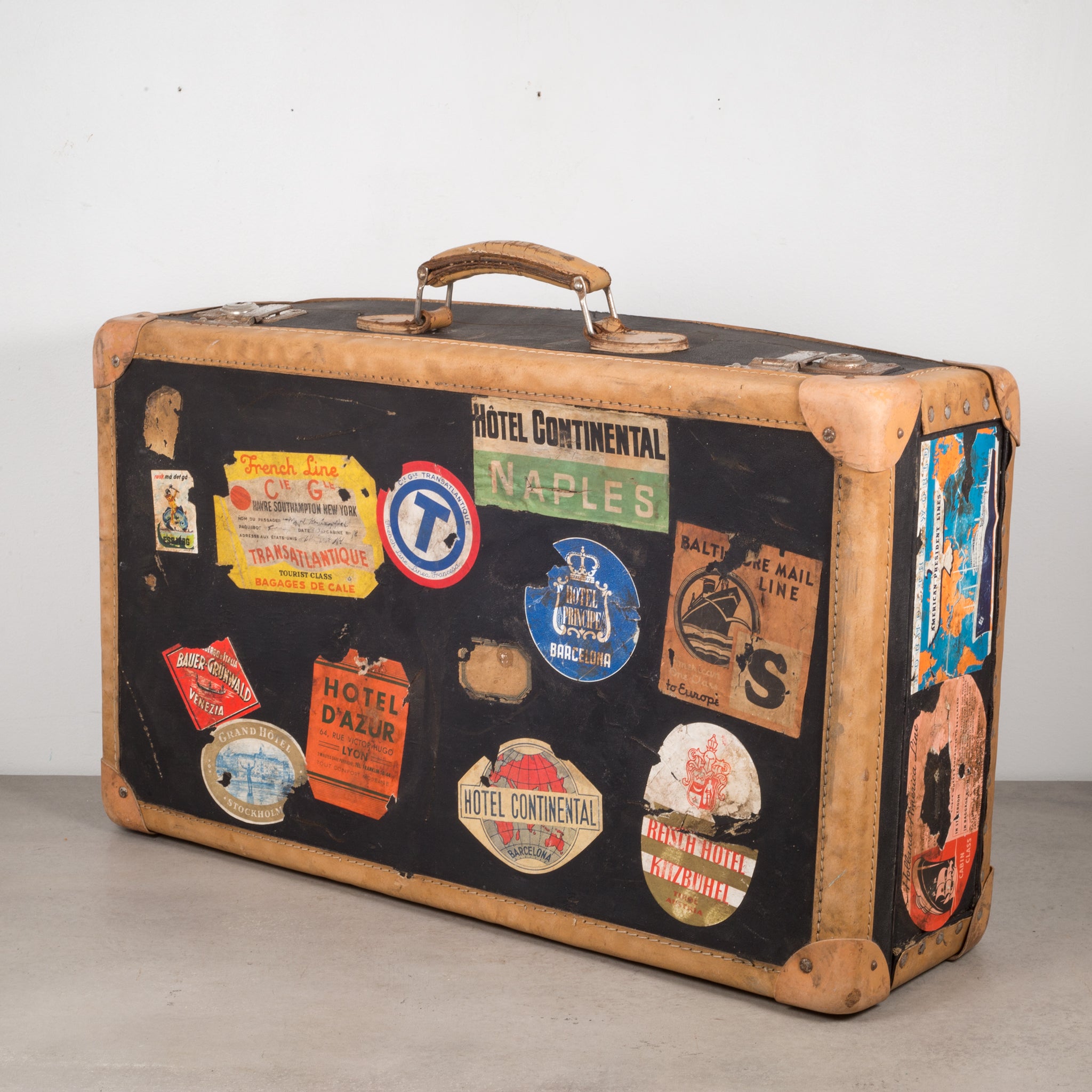 Vintage Suitcase. Leather suitcase with retro travel stickers