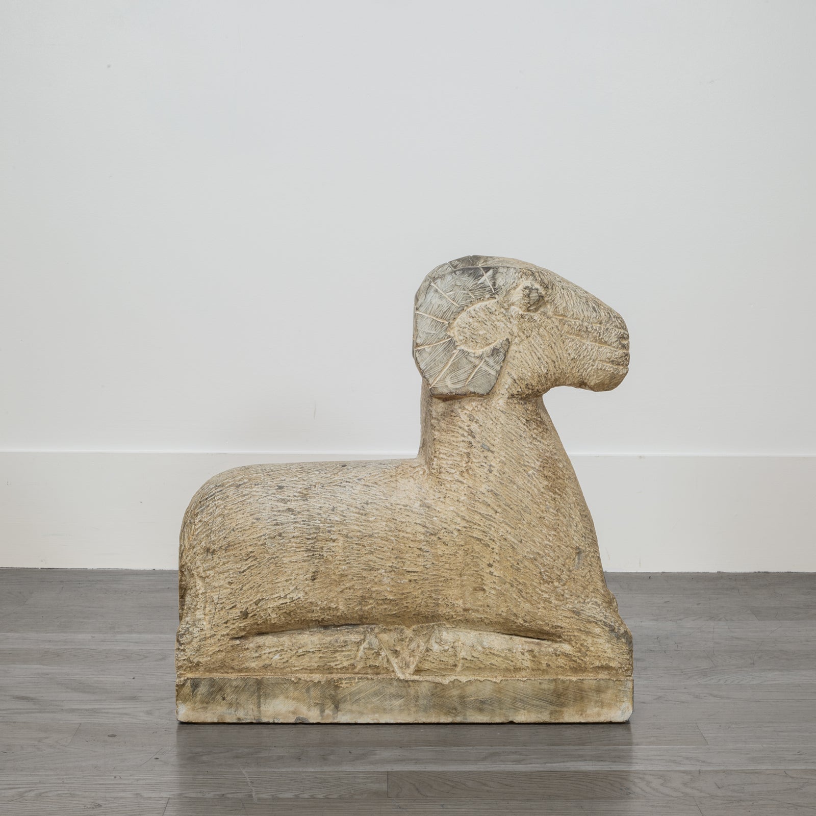 Pair of Art Deco Style Carved Sandstone Reclining Rams, 20th c